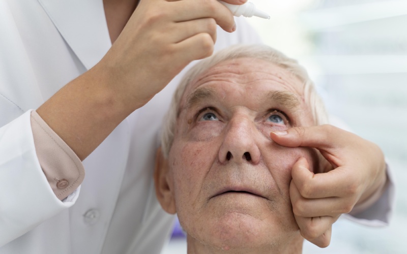 doctor pouring some eye drops