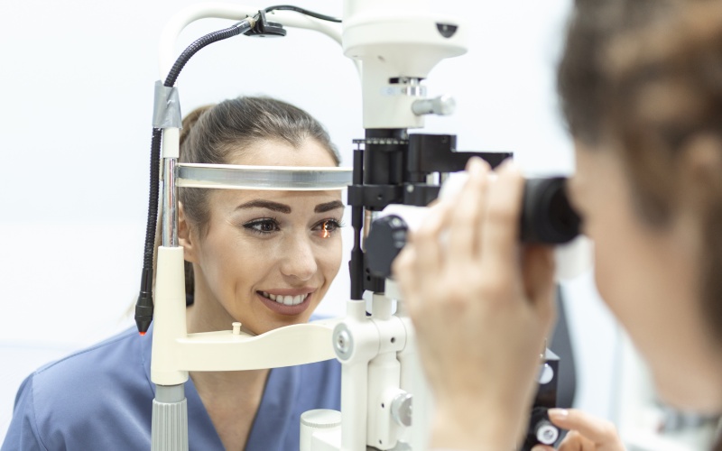 eye-doctor-with-female-patient examination modern clinic ophthalmologist is using-special medical equipment